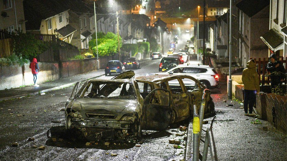 Mayhill: Cars were left burnt out when violence erupted in Mayhill on Thursday