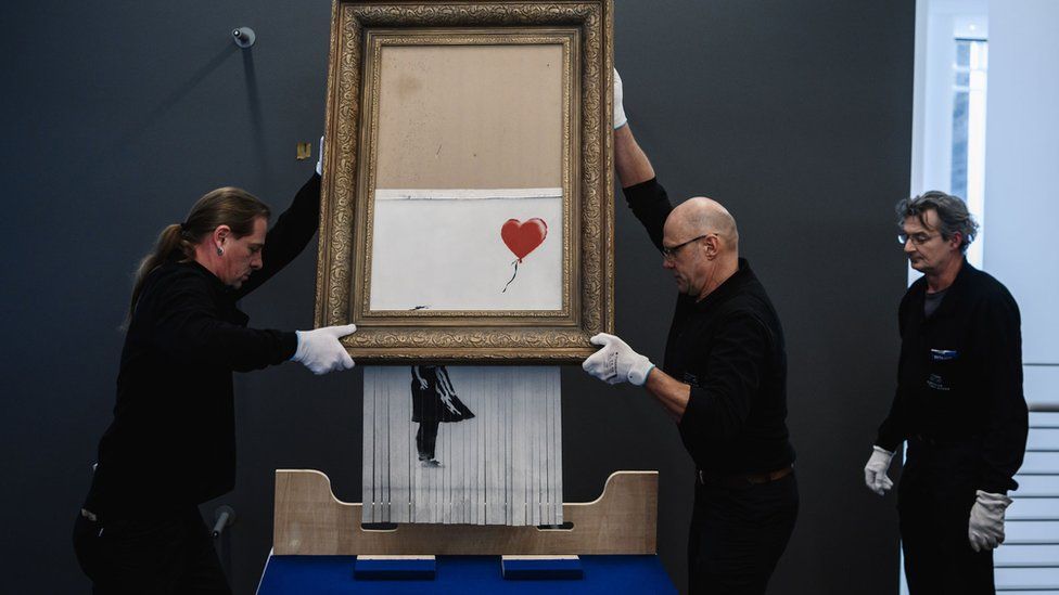 Бэнкси предупредили о недостатке веб-сайта до взлома NFT 3 Banksy's Girl with Balloon was shredded seconds after the hammer fell at an auction at Sotheby's in October 2018