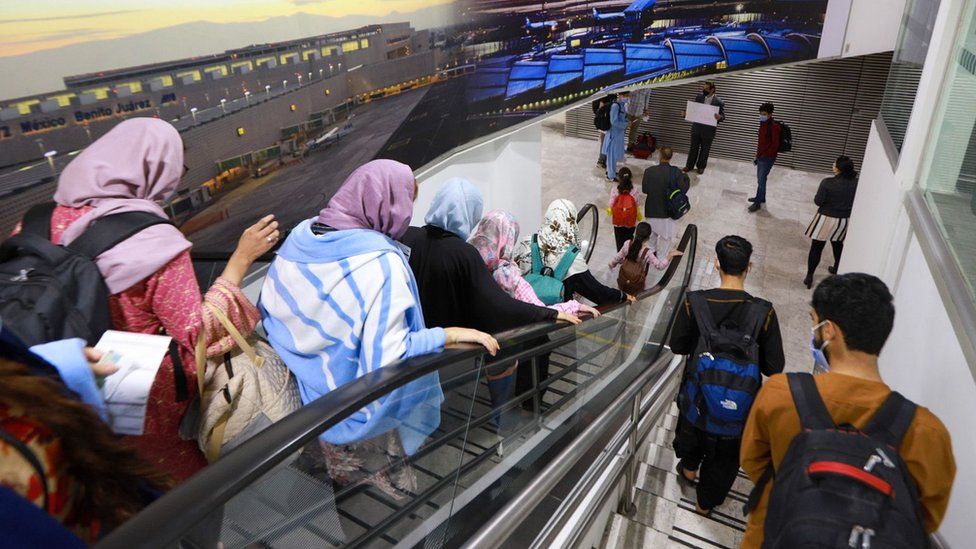 A group of Afghan citizens arriving at the Mexico City International Airport