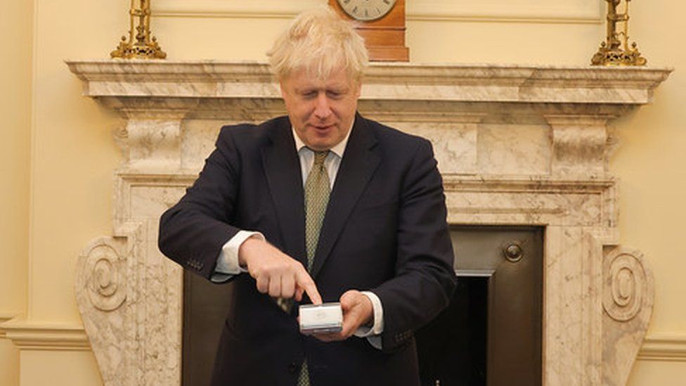 Image caption, The prime minister, in Downing Street, paying using a Pax terminal