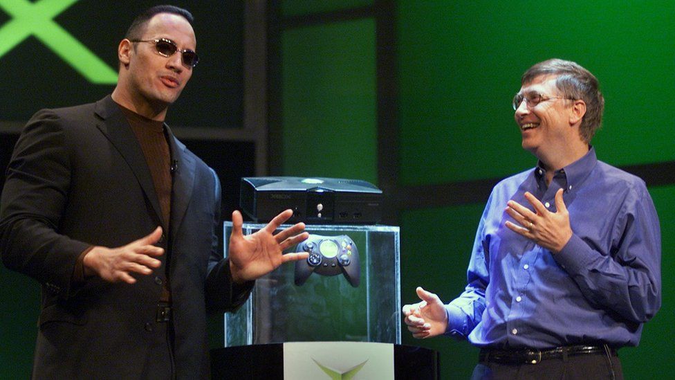 Image caption, The Rock and Bill Gates unveiling the original Xbox in 2001