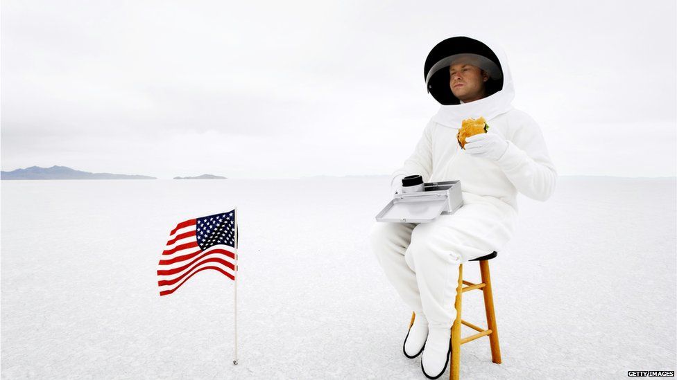 SpaceX: A stock image of an astronaut eating a hamburger