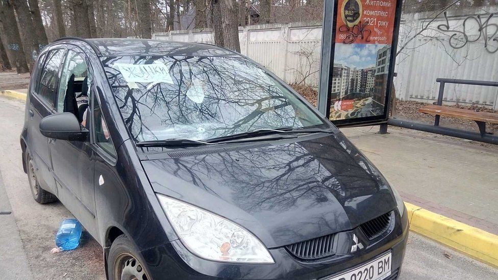 , The bodies of a man and a woman in a pink coat were found in this car after the Russians left