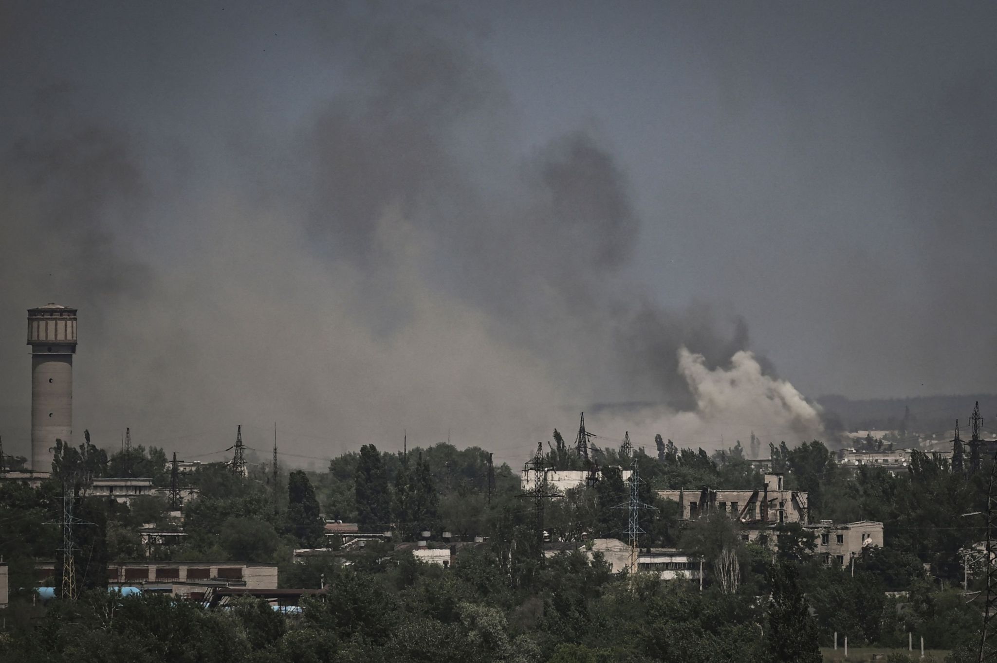 , Smoke and dirt rising above Severodonetsk amid intense fighting in the eastern city on Thursday between Russian and Ukrainian forces