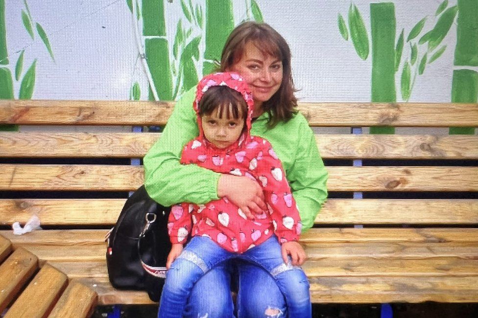 , Oksana Litvynyenko with her daughter. Oksana was badly wounded in April and died on Sunday. (Family handout)