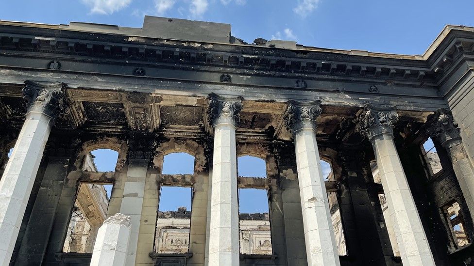 , The columns of the Palace of Culture are now charred and broken