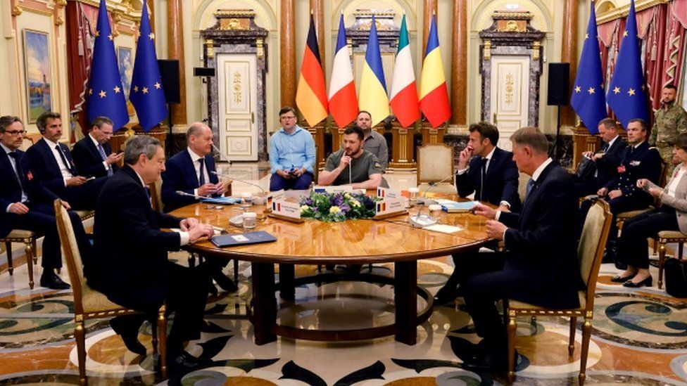 , From left to right at the table: Italian PM Mario Draghi, German Chancellor Olaf Scholz, Ukrainian President Volodymyr Zelensky, French President Emmanuel Macron and Romanian President Klaus Iohannis