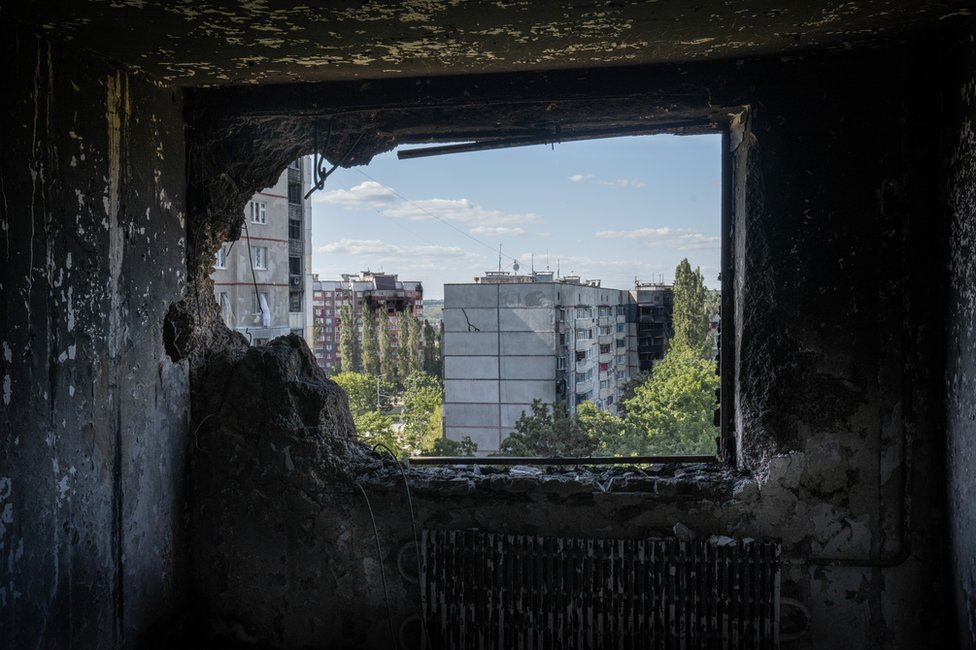 , The view from a destroyed Saltivka apartment. Many have been turned to little more than ash