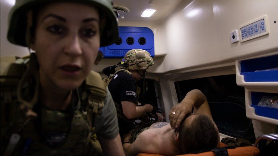 , Jess spent time with the volunteer medics - this photo was taken in the Zaporizhia region where medics were treating a surgeon whose foot was blown off by a landmine