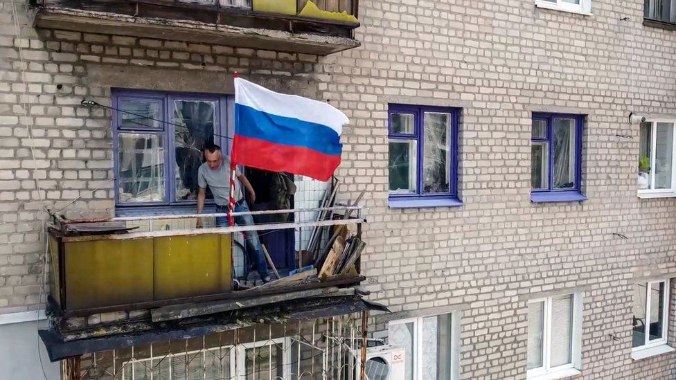 , Moscow's defence ministry distributed this video showing a Russian flag being flown from a balcony in Lysychansk