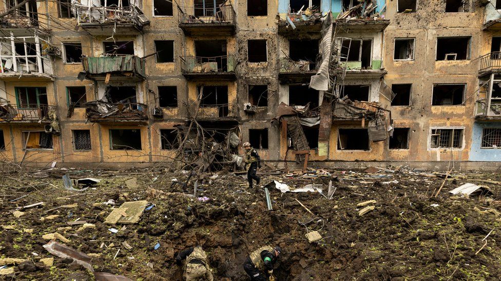 Ukrainian military inspect the site of a Russian missile strike in the Donetsk region