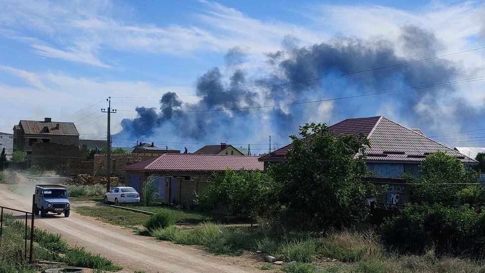 Smoke rises after explosions were heard from the direction of a Russian military airbase near Novofedorivka