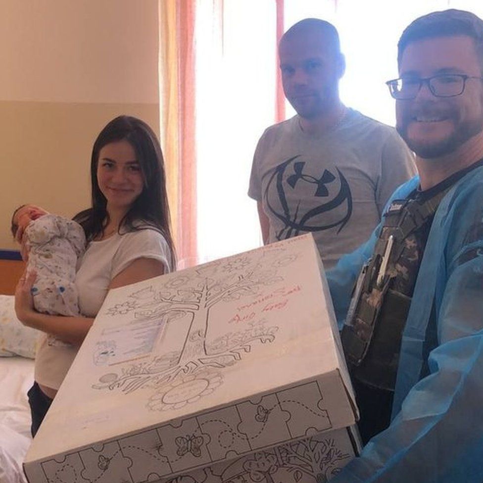 New parents in Ukraine with their baby box