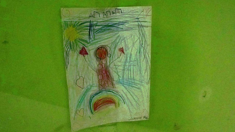 A child's drawing on the wall of the village council