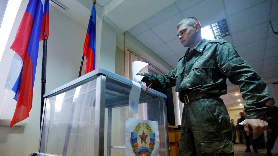 Russia allowed the media into some polling stations, including this one in Luhansk, where a soldier cast his vote