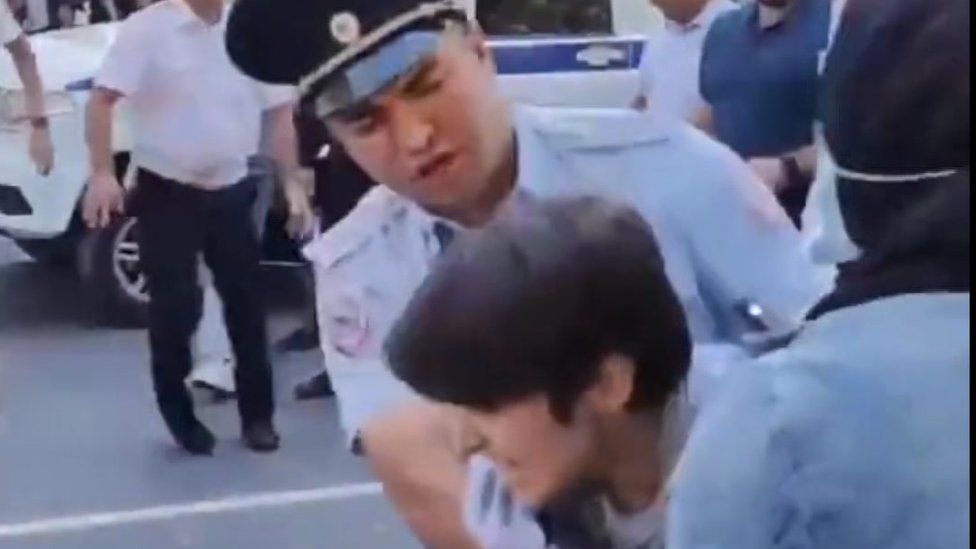 Police detain a protester in Makhachkala