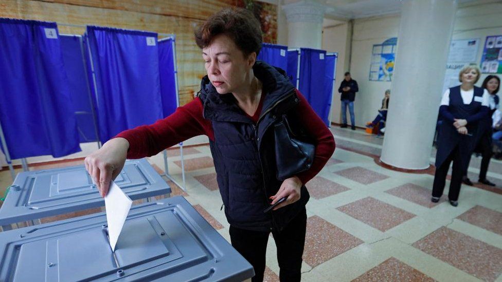 A voter in Donetsk on Tuesday casts her ballot during the referendum
