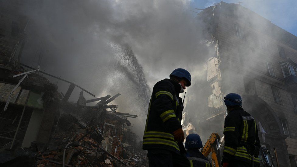 Rescuers work at the site of a residential building heavily damaged by a Russian missile strike in Zaporizhzhia, Ukraine