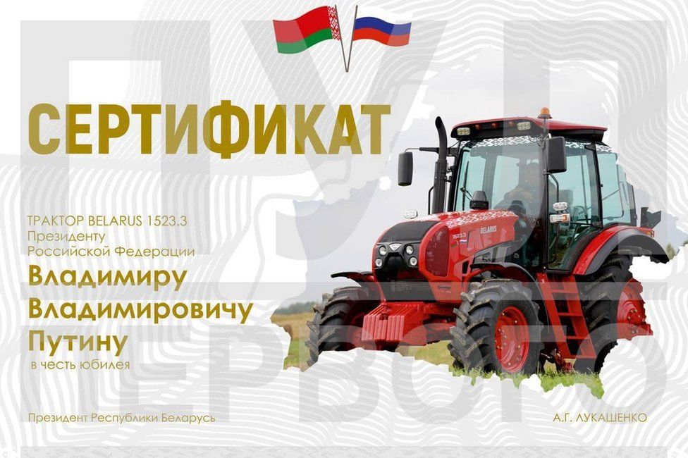 Mr Putin was given a certificate to say he had been presented with a Belarusian tractor