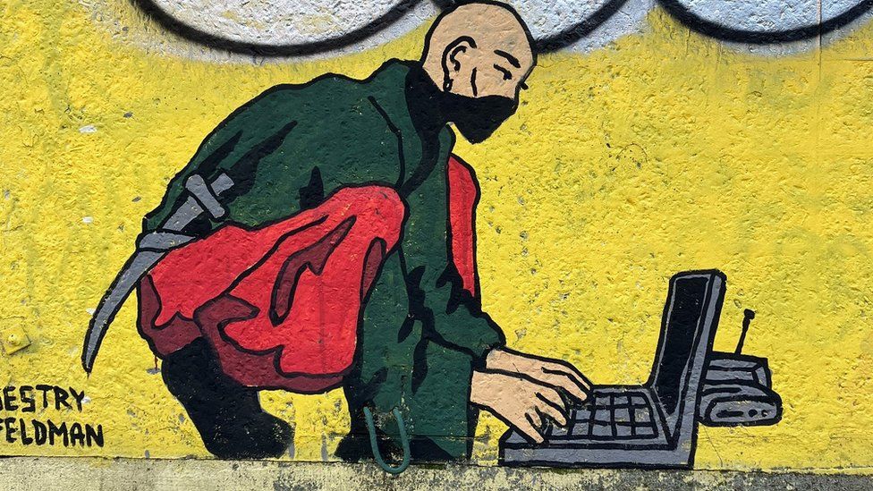 A mural of a hacker has appeared on the streets of Kyiv