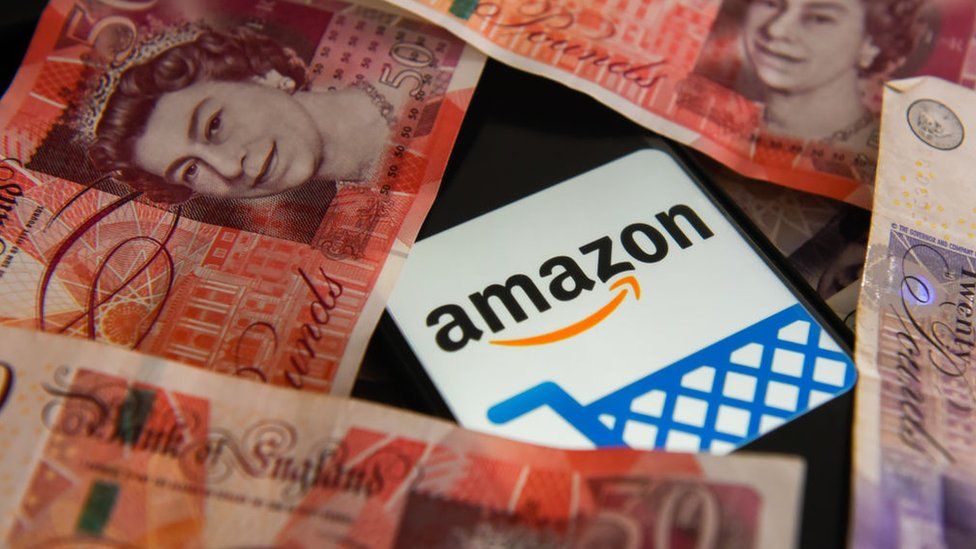 Amazon logo surrounded by money