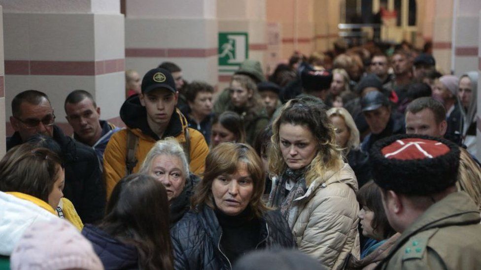 People moved from Kherson arrive in Crimea, ahead of onward travel into Russia.