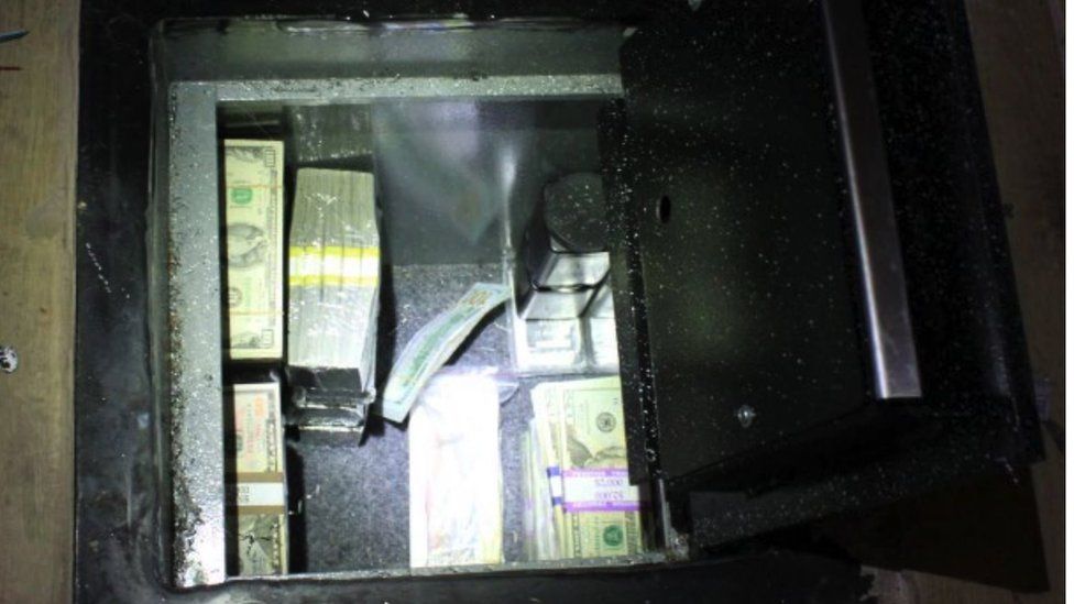 As well as the Bitcoin, police found $600,000 in cash in an underfloor safe