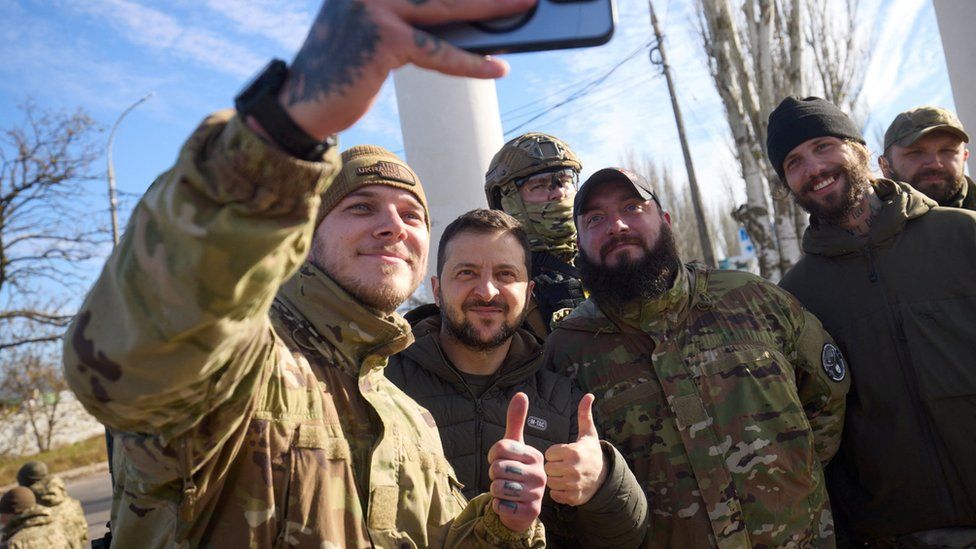 President Zelensky with soldiers on Monday