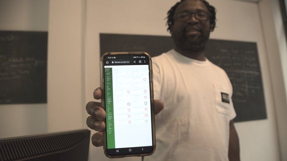 Stanford Mogotsi, here showing the app his firm designed for Heineken, says it can be difficult for small IT companies to win work