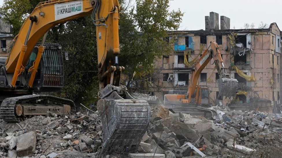 Work to remove debris from flattened buildings taking place in Mariupol