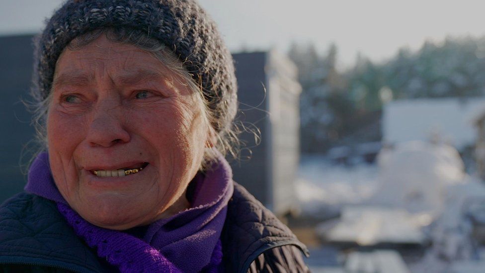 Inna crying outside her home in Kalynivka