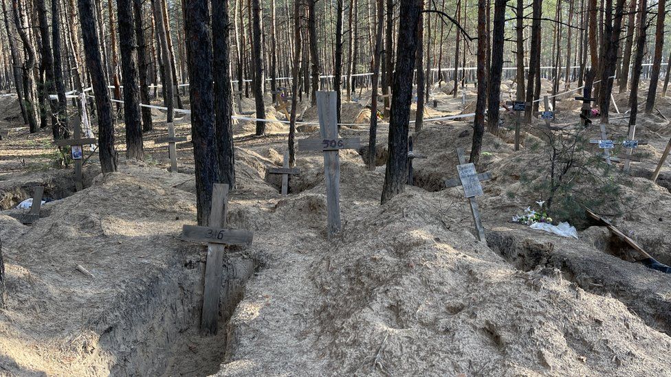 Authorities have exhumed nearly 900 bodies so far in the Kharkiv region