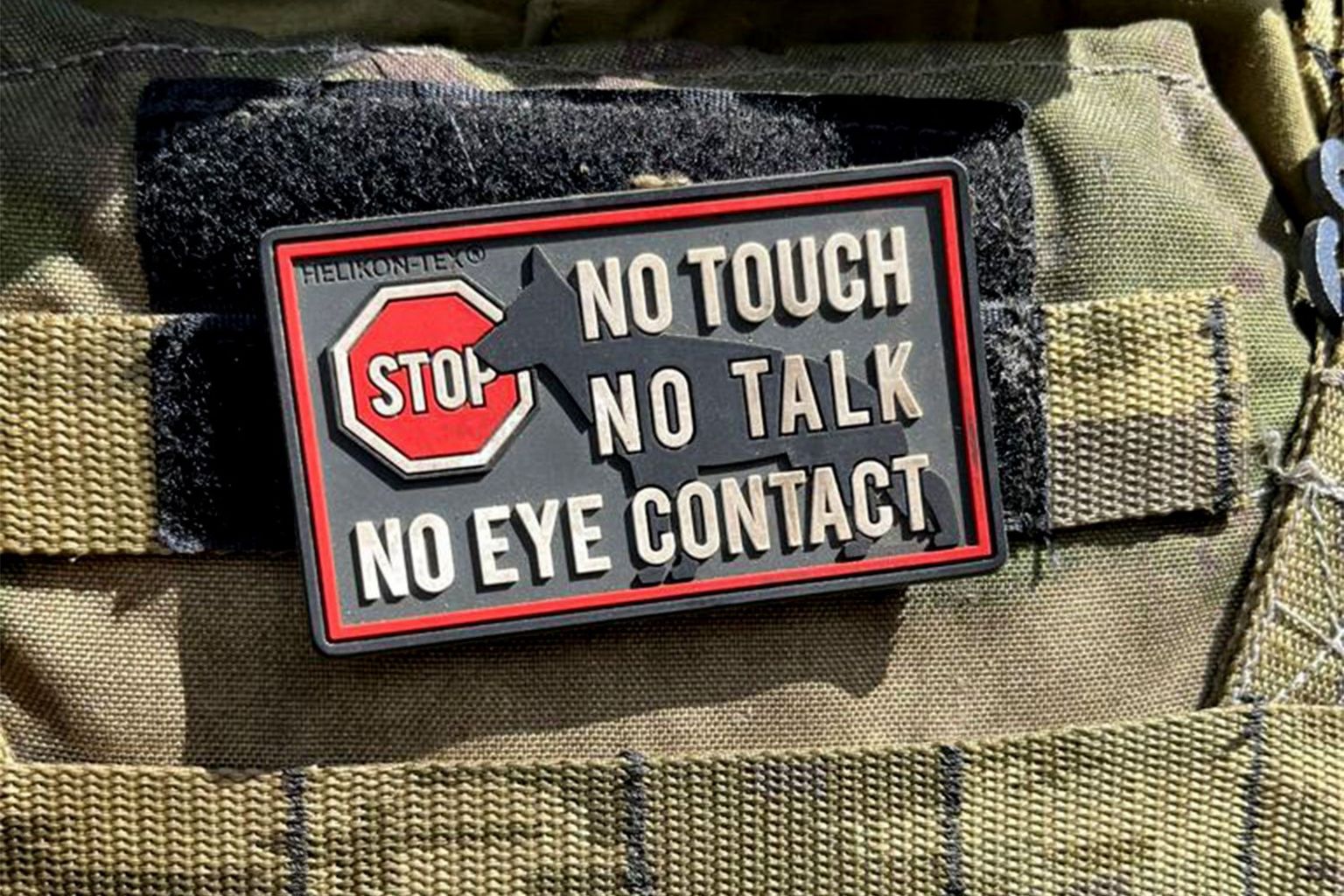 Badge reads: NO TOUCH, NO TALK , NO EYE CONTACT