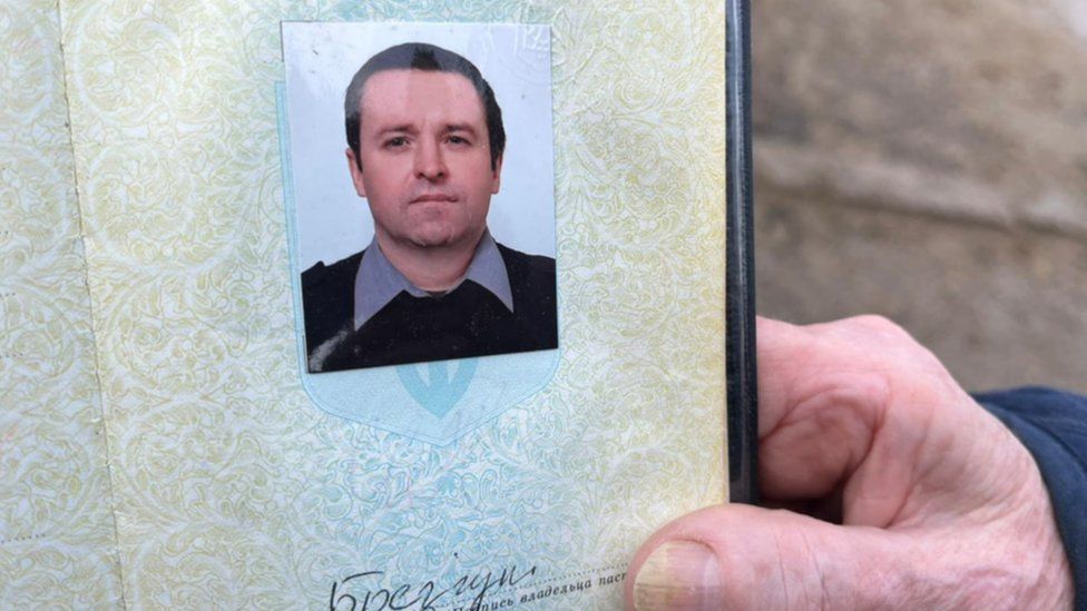 Serhii's passport was retrieved from the ruins of his home