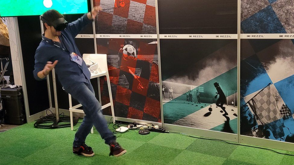 Tom Ffiske, here playing a VR game of football, says that working in the metaverse is a long way off for most of us