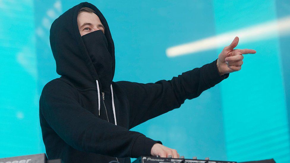 Alan Walker, who has always worn a mask when performing, says he wants to give back to his fans