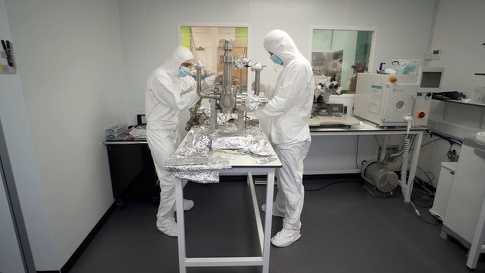The quantum computer chips have to be set up in a clean room an put into a vacuum container as even the slightest contamination can reduce its performance