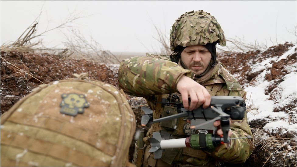 Ilya and Oleksii use drones armed with grenades to attack Russian troops a short distance away