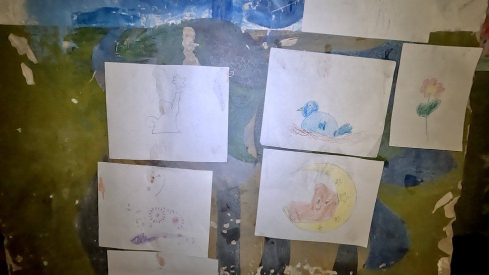 Anna's colourful drawings line the walls of the basement