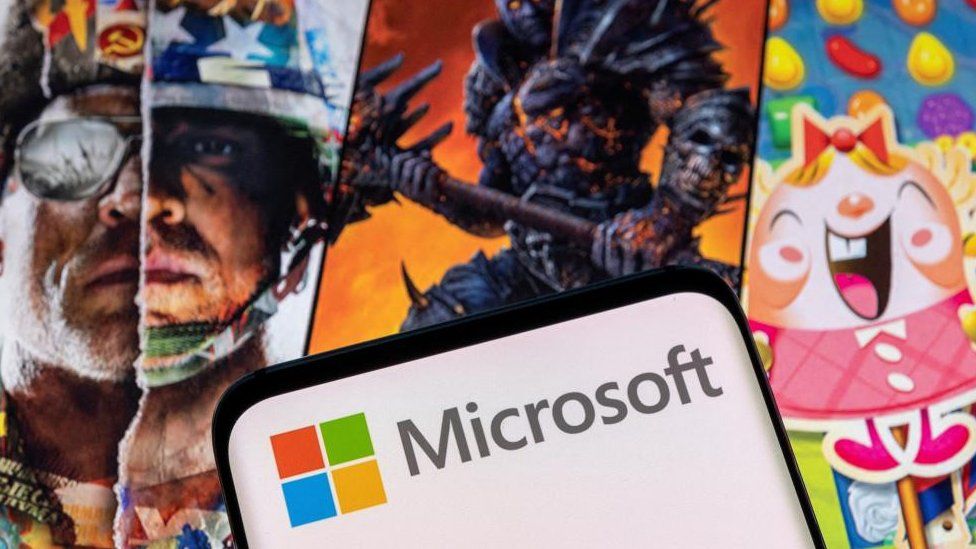 Microsoft logo in front of Activision game art