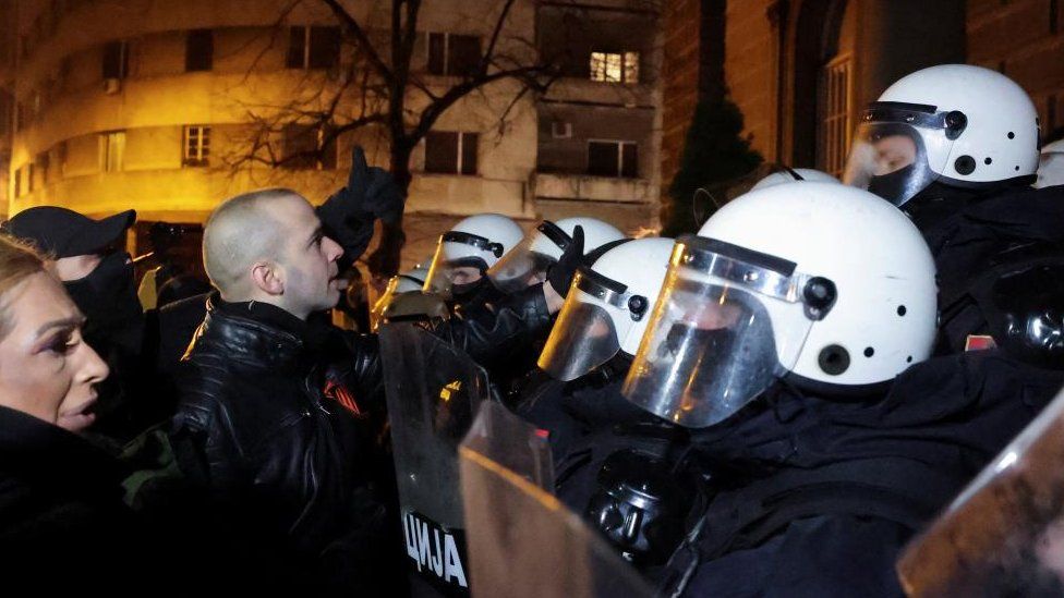 Police blocked far-right leader Damjan Knezevic as he and other protesters tried to storm the presidency