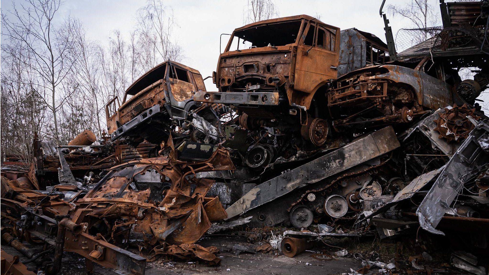 A graveyard of Russian vehicles from the convoy piled high in Hostomel