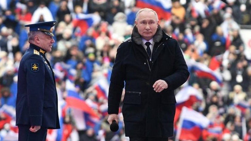 Vladimir Putin spoke to flag-waving crowds at a rally at a football stadium on Wednesday