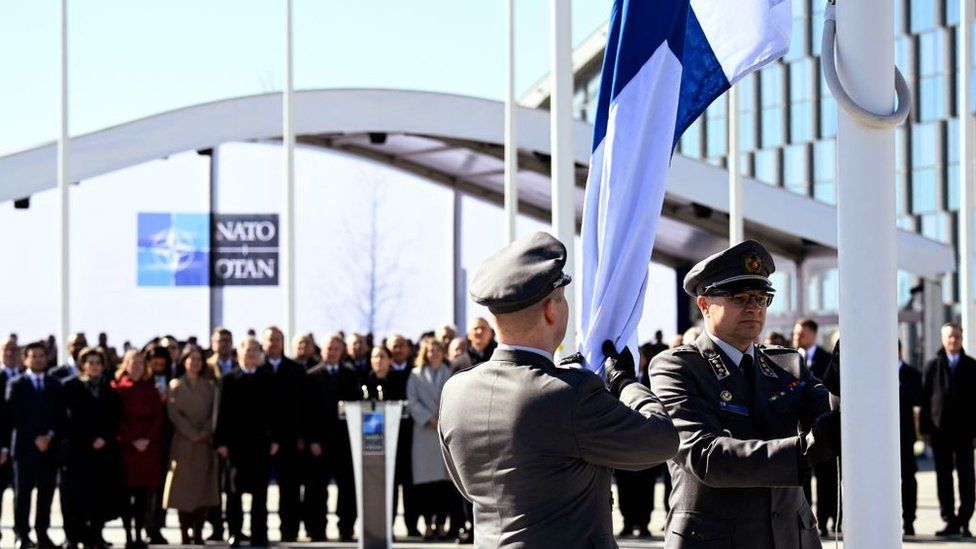 Finnish military personnel raised their country's flag at Nato headquarters for the first time
