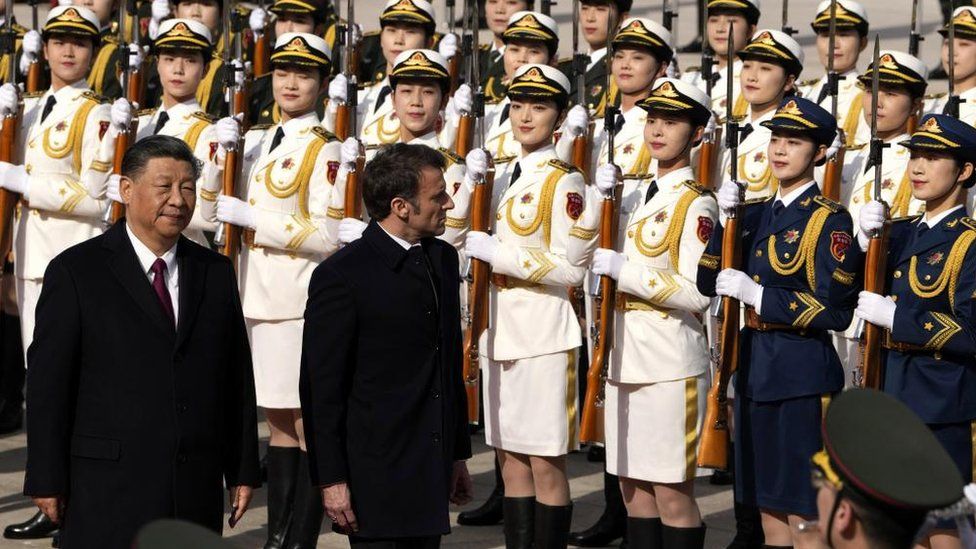Mr Macron was greeted with an elaborate military parade outside the Great Hall of the People