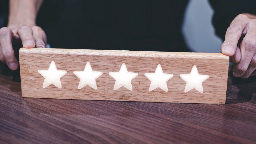 Five stars on a wooden board