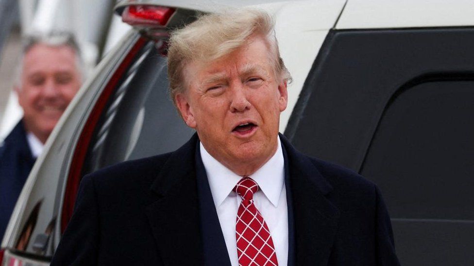 Former U.S. President and Republican presidential candidate Donald Trump reacts after arriving at Aberdeen International Airport in Aberdeen, Scotland, Britain May 1, 2023.