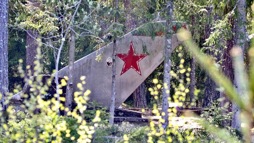 Soviet pilots are buried along with the tailplanes of their old MiG-15s and MiG-17s in a nearby forest