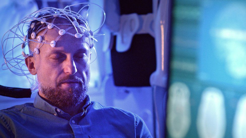 A stock image of someone having an EEG in a lab
