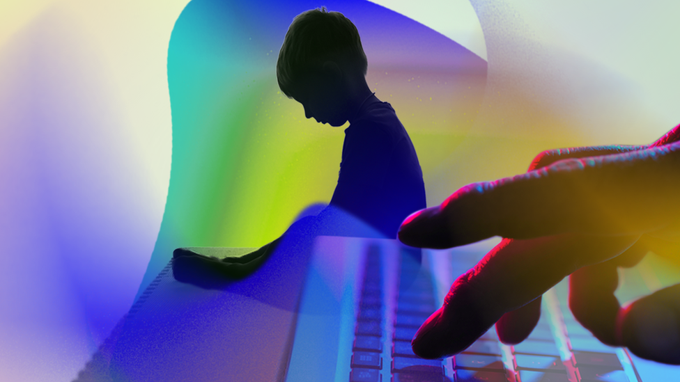 Artistic image showing the shadow of a small child in the background and an adult's hand on a computer keyboard in the foreground.